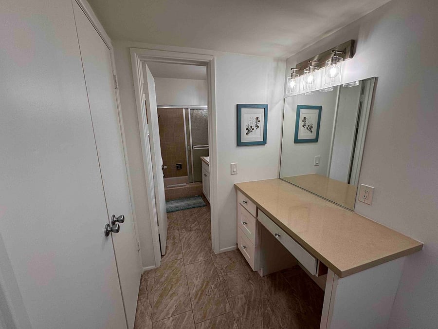 Dressing room and makeup table adjacent to primary bedroom and bath