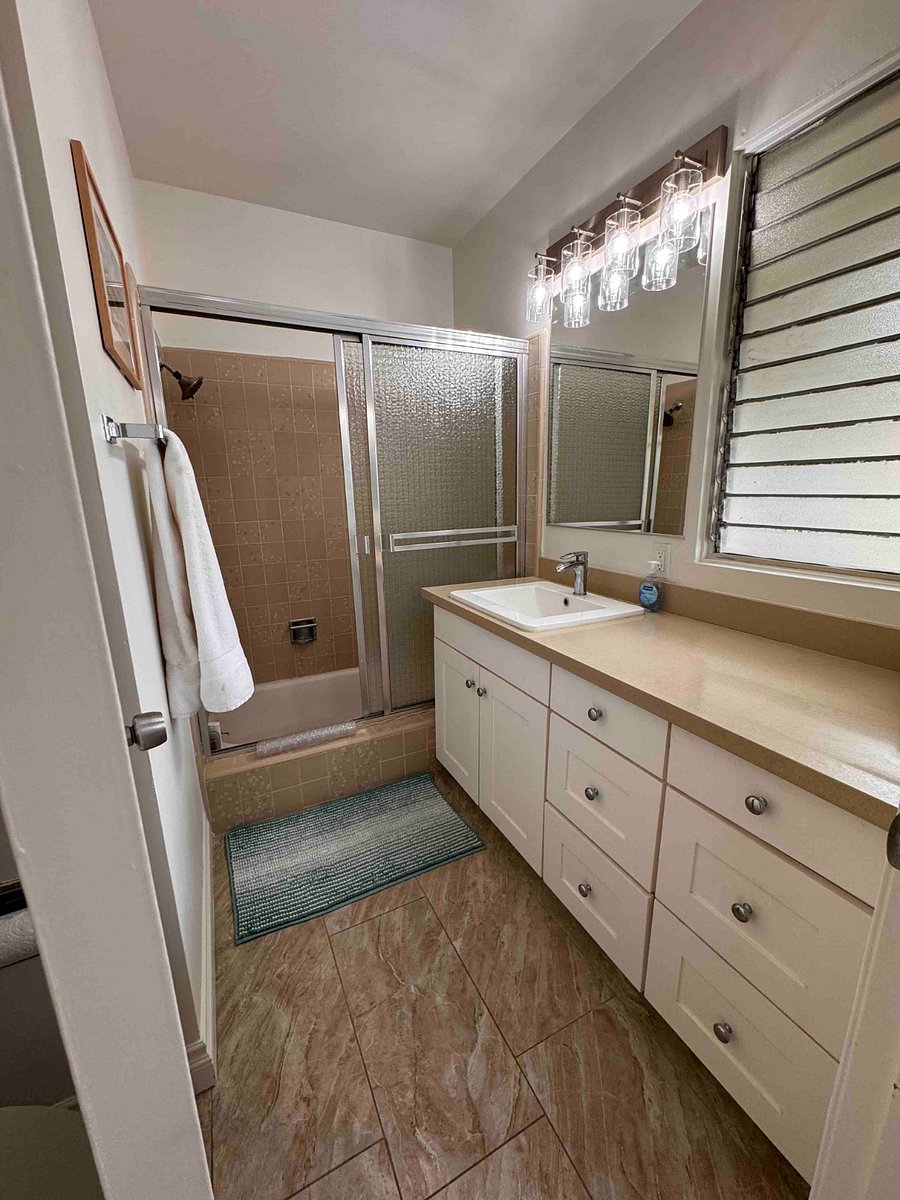 Primary bedroom full shower and tub