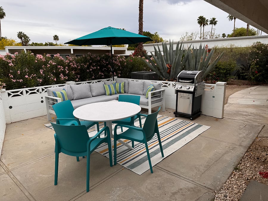 Enclosed patio with lounge, dining and BBQ gas grill