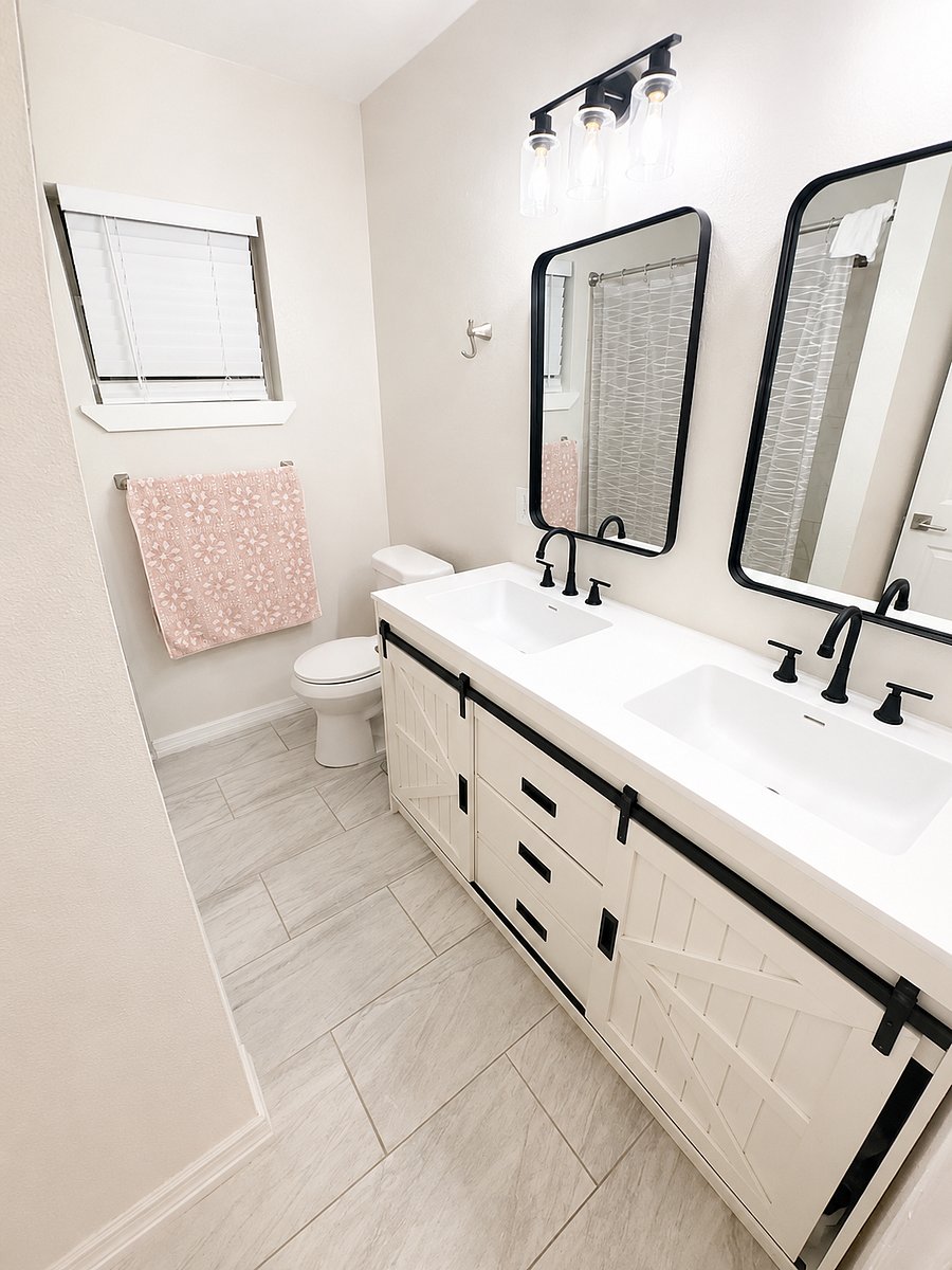 Spacious double vanity with modern fixtures and plenty of storage.