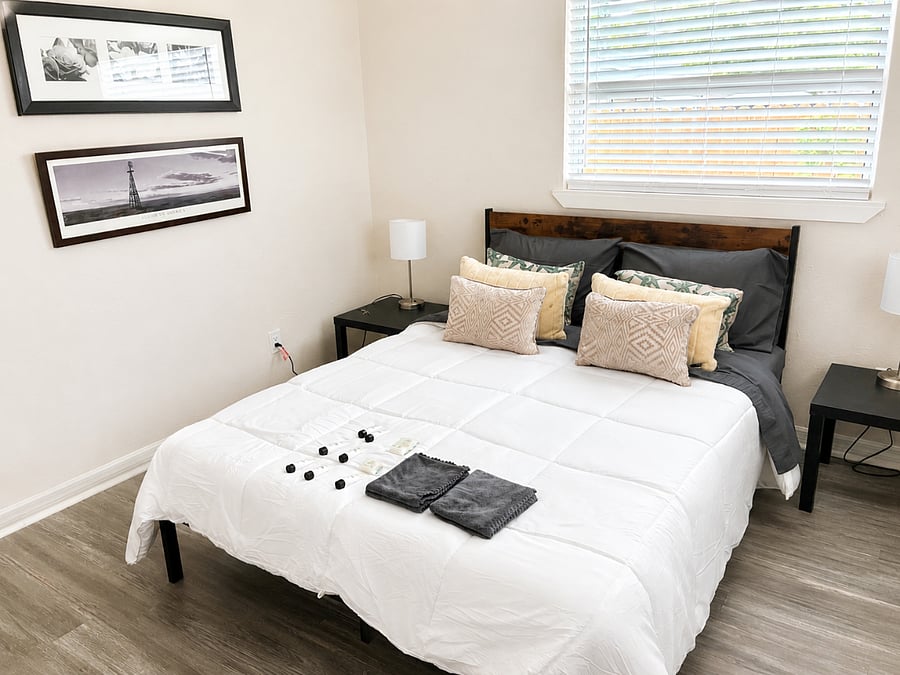Bright sleeping space with cozy bedding and modern dcor.