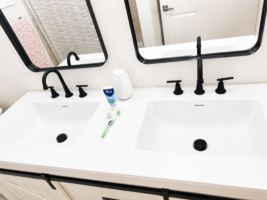 Contemporary bathroom with dual sinks and sleek design.