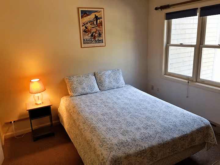 Downstairs bedroom with queen bed and standard closet.