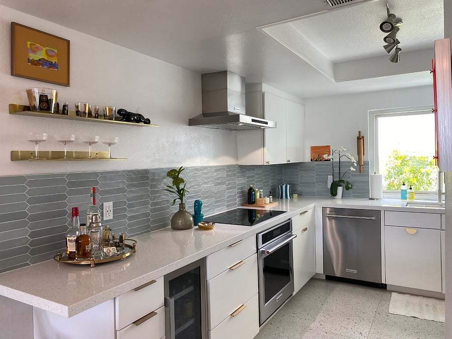 Fully stocked kitchen with KitcheAid appliances including induction cooktop, oven, dishwasher and more