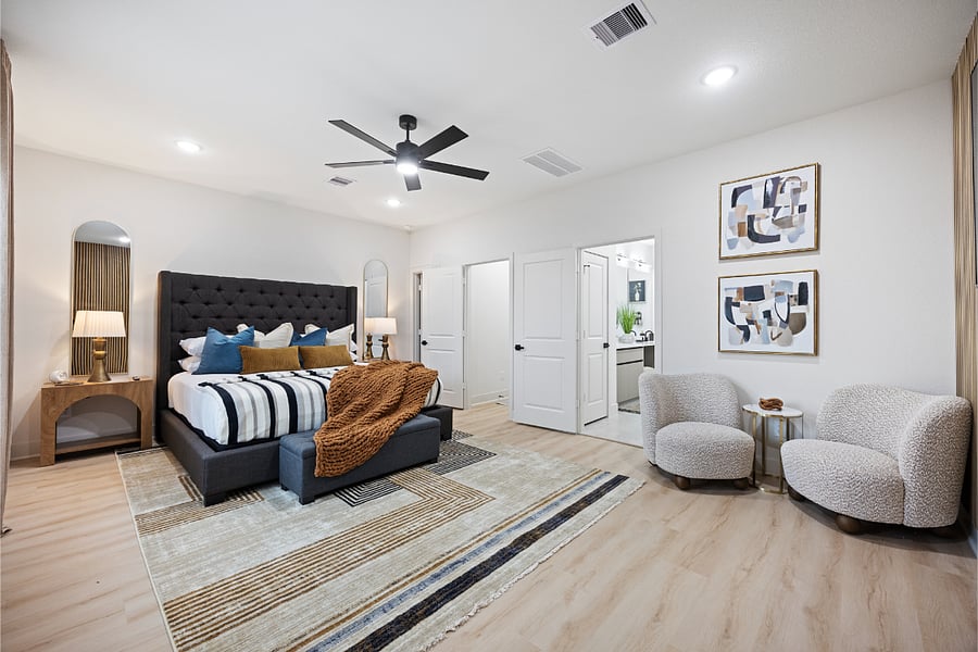 Primary suite with king bed and sitting area