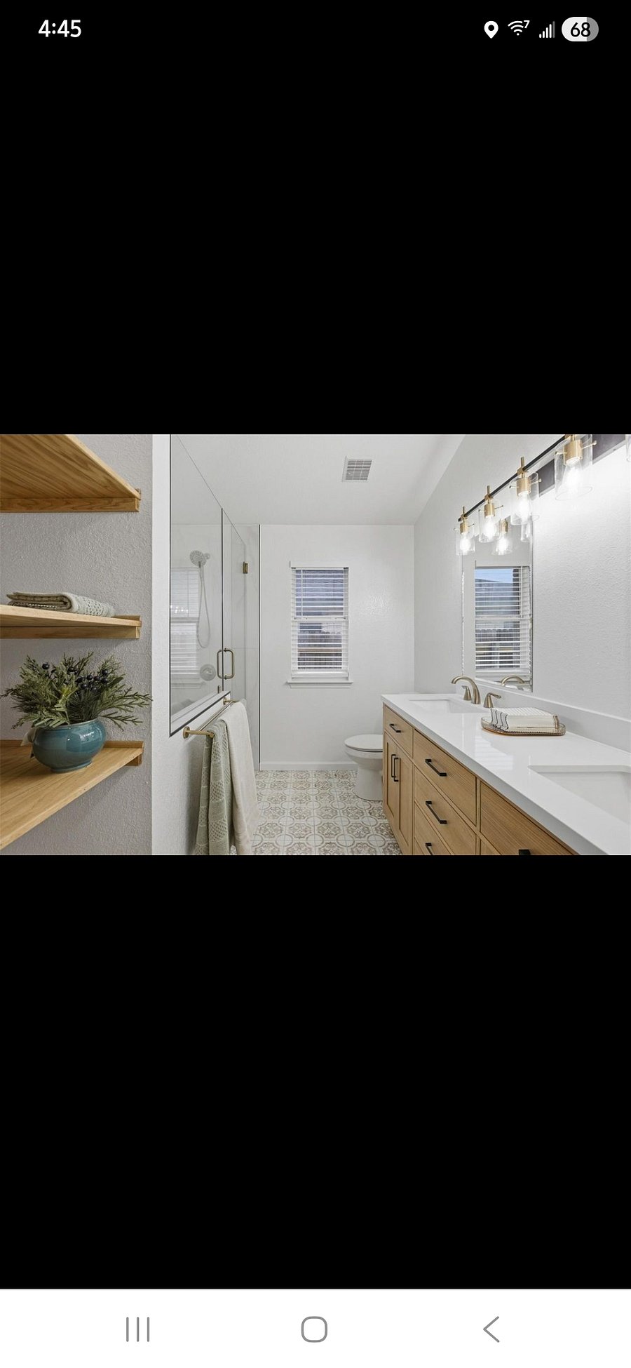 This beautiful master bathroom has a nice sized walk-in shower and double vanity.  