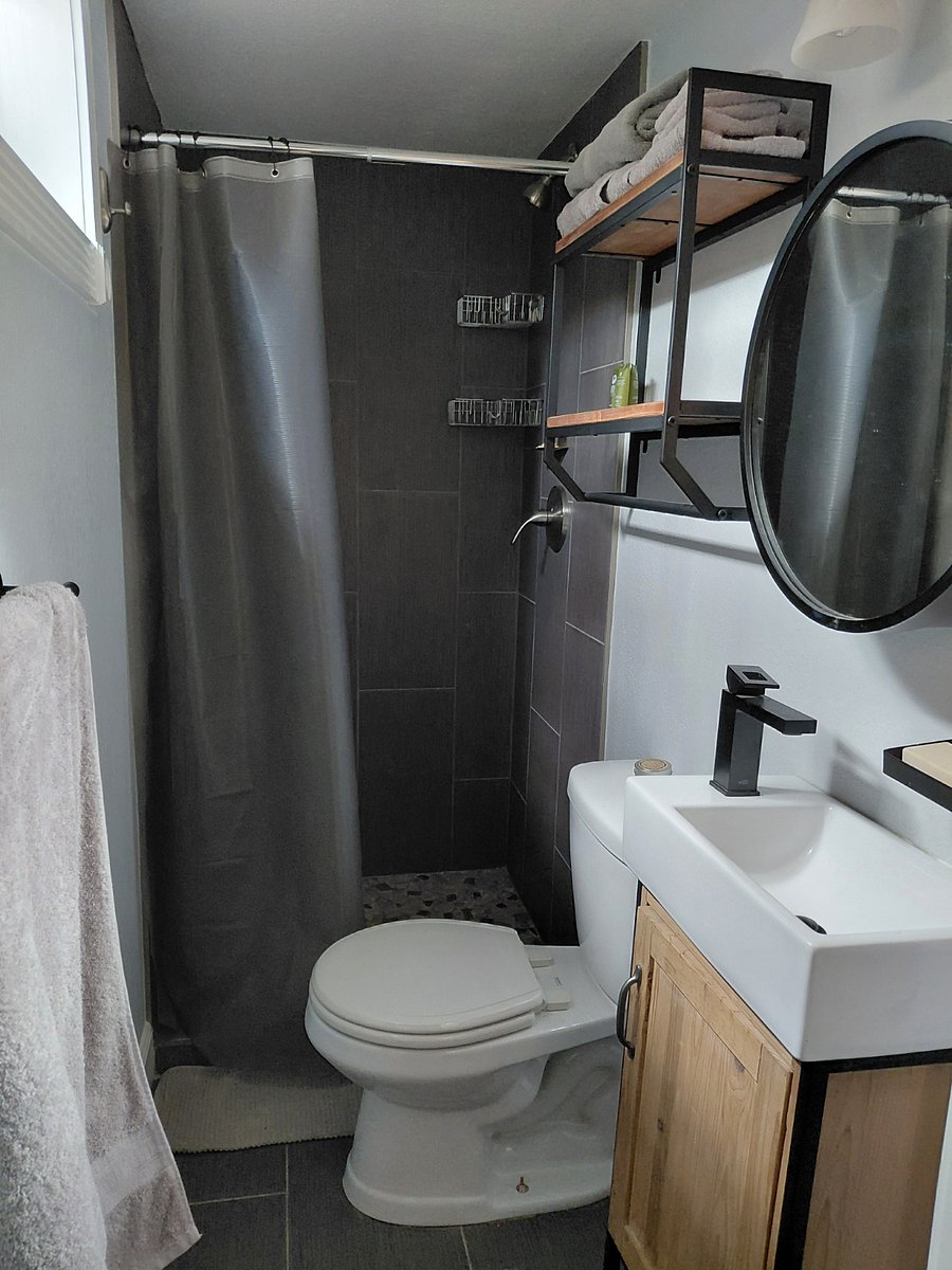 private 3/4 bath with toilet, sink, and shower