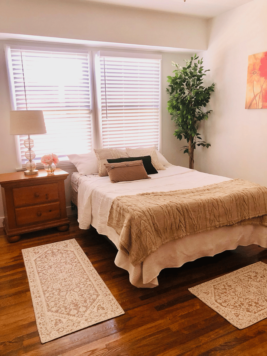Peaceful primary bedroom featuring a comfortable queen-size bed, quality linens, and a relaxing atmosphere for restful nights.