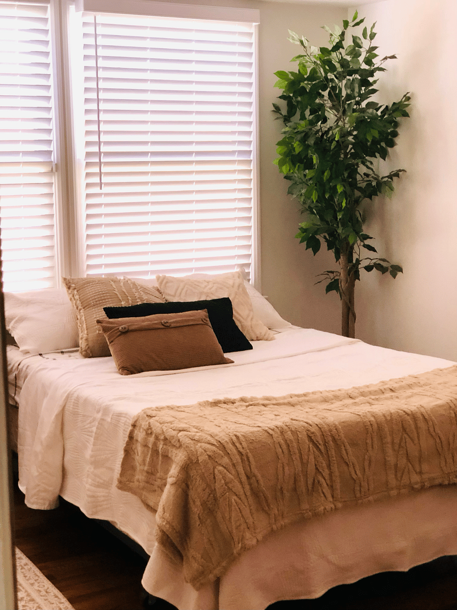 Spacious primary suite with generous natural light and plenty of room to unwind.