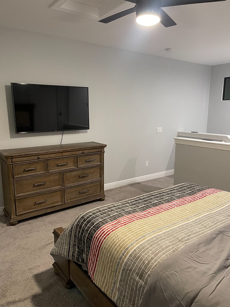 Spacious loft-style bedroom with a private bathroom
