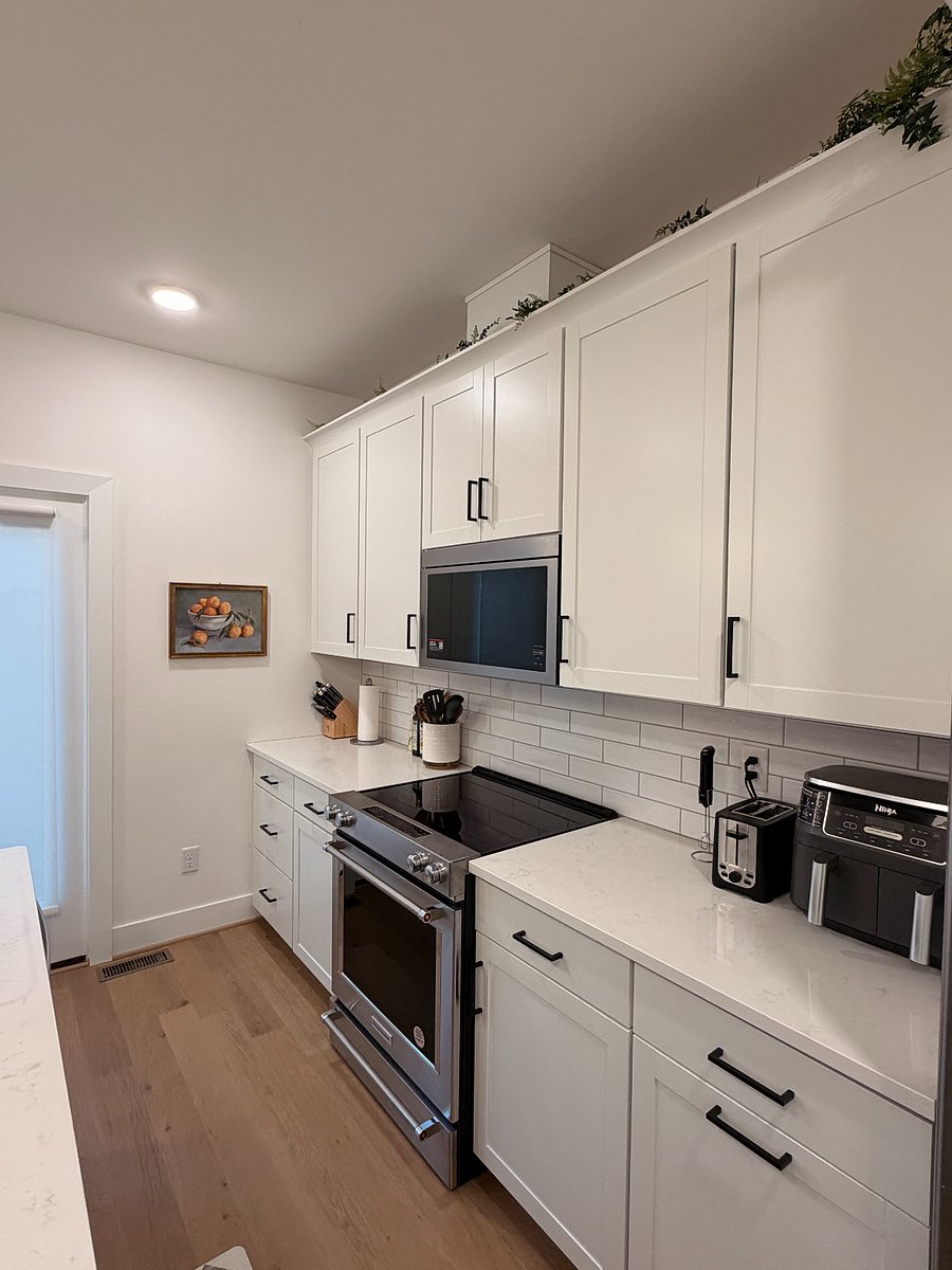 Kitchen with airfryer, toaster, cooking utensils and more