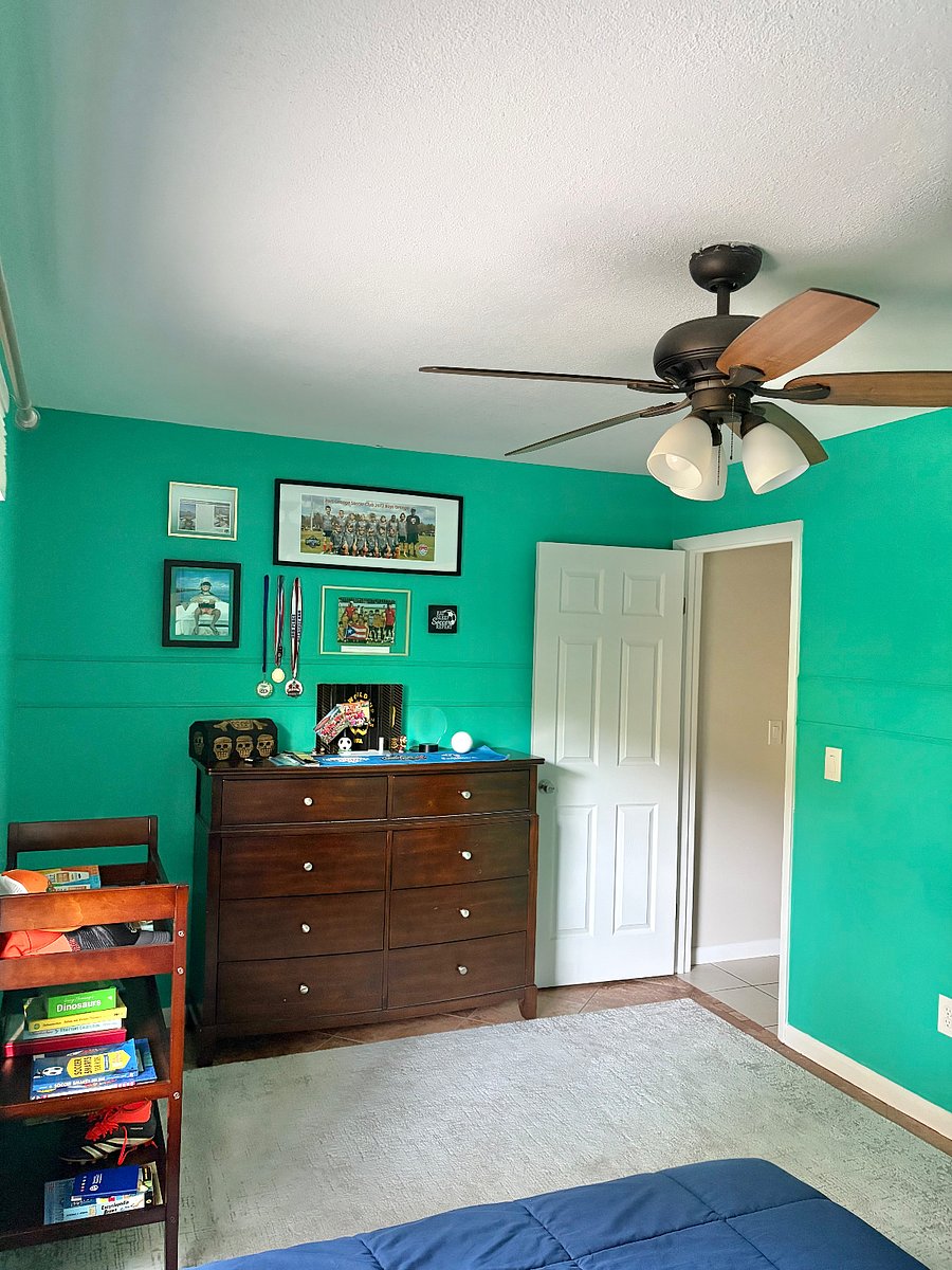 Doorway and dresser in Bedroom 2. Owners personal items and photos will be removed from the rental.