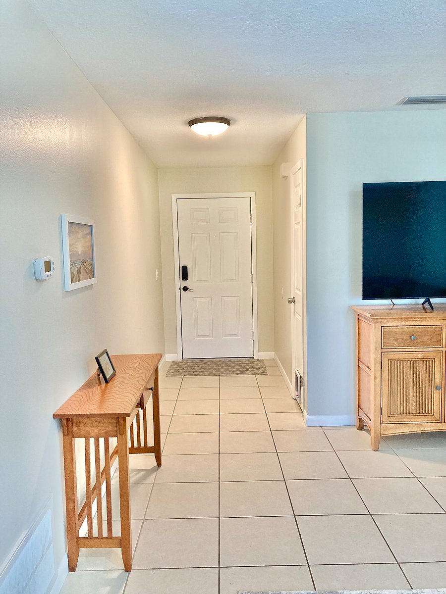 Front door and entry way. The front door has a keypad entry.