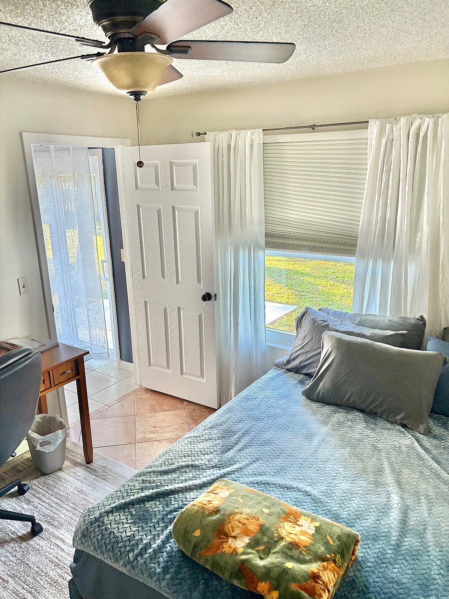 Bedroom 3 has a queen size bed, closet and a window with a nice view of the backyard.