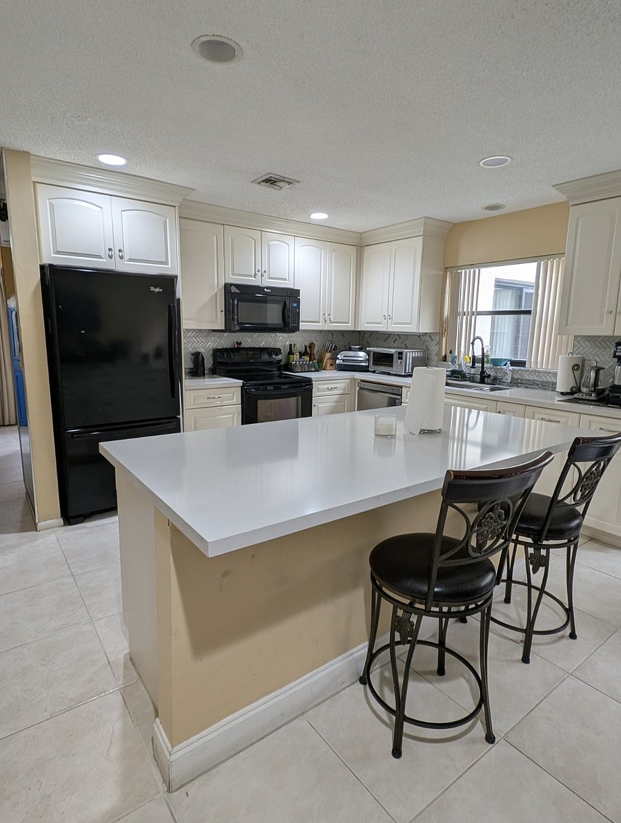 Fully equipped kitchen with Ninja Air fryer and Nuwave Convection Oven.