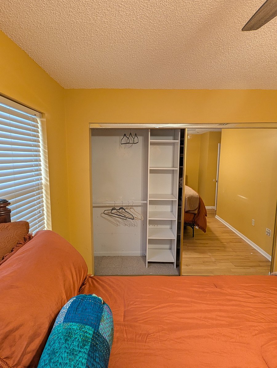 Shelving in the closet. Dual hanging rods.