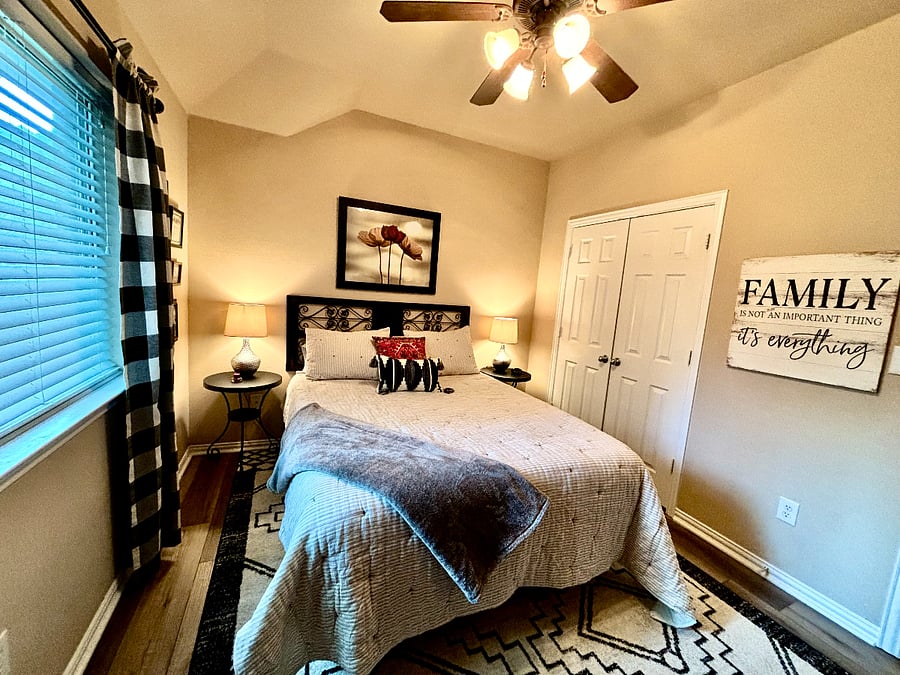 2nd bedroom with queen bed and dresser