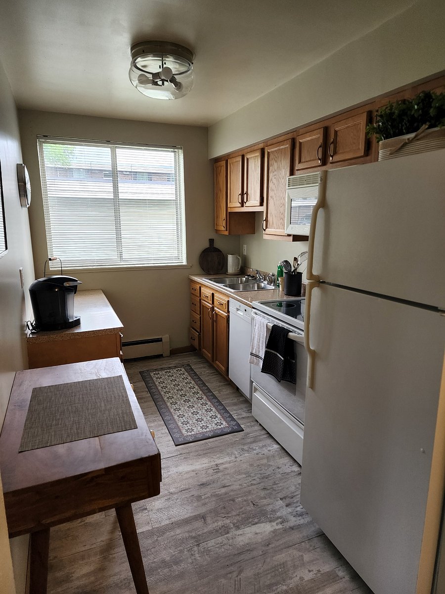 Galley kitchen complete with dishwasher and microwave.