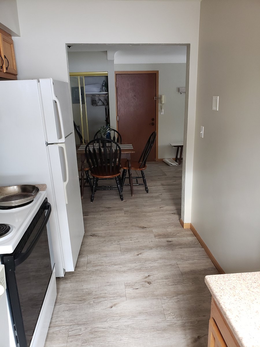 Dining Room viewed from kitchen. Apartment entry door is just beyond the table in this picture.