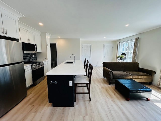 Luxury kitchenette with larger quartz island.