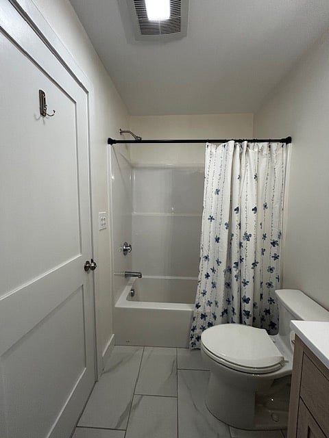 Bathroom with exhaust fan and heater.