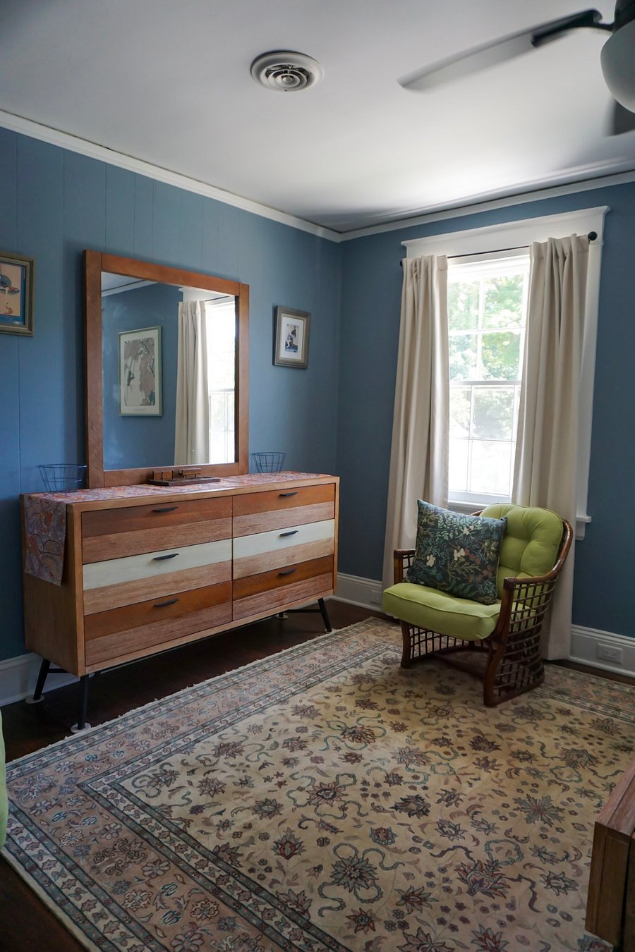 Front bedroom: large double dresser with mirror, pair of chairs.
