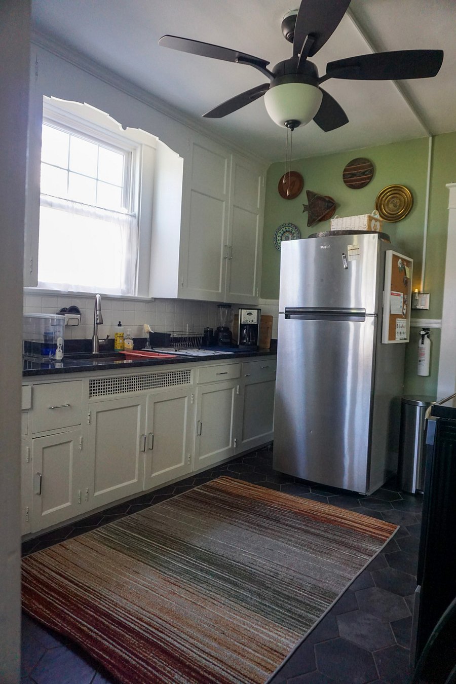 Kitchen: original hand-built cabinets, new ceiling fan, new electric.