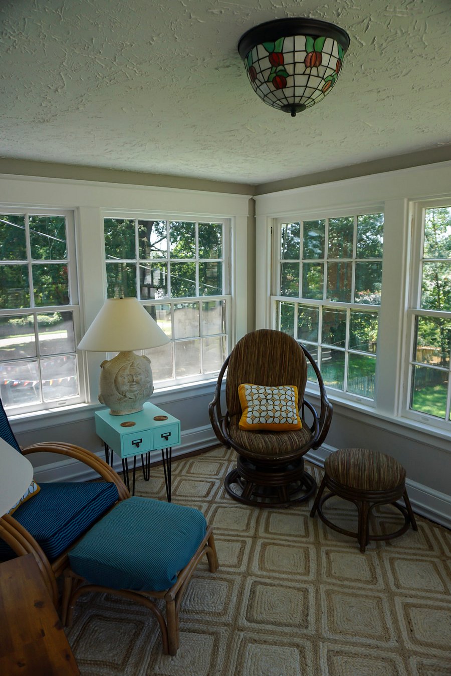 Upstairs sun porch: has the advantage of being in the trees. Several of the windows open and have screens if you're around in the fall or spring.