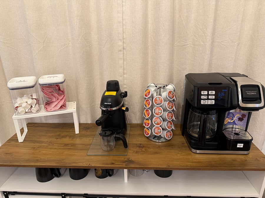Coffee station with the option for pods, or carafe, along with a mini-espresso machine.
