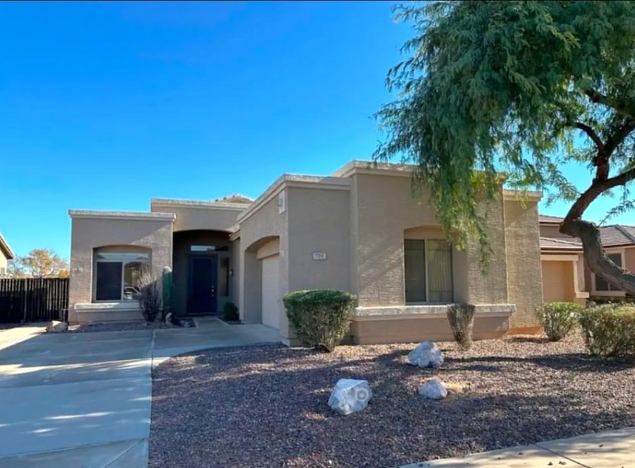 Exterior features southwest style with desert landscaping.
