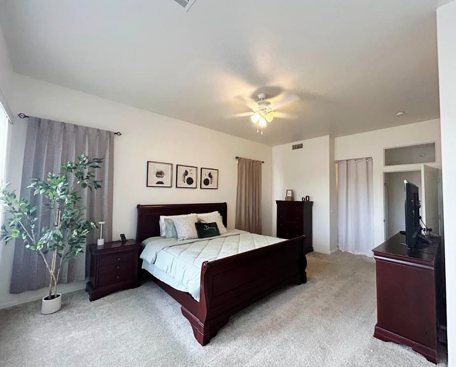 Primary bedroom suite with connected large bathroom.