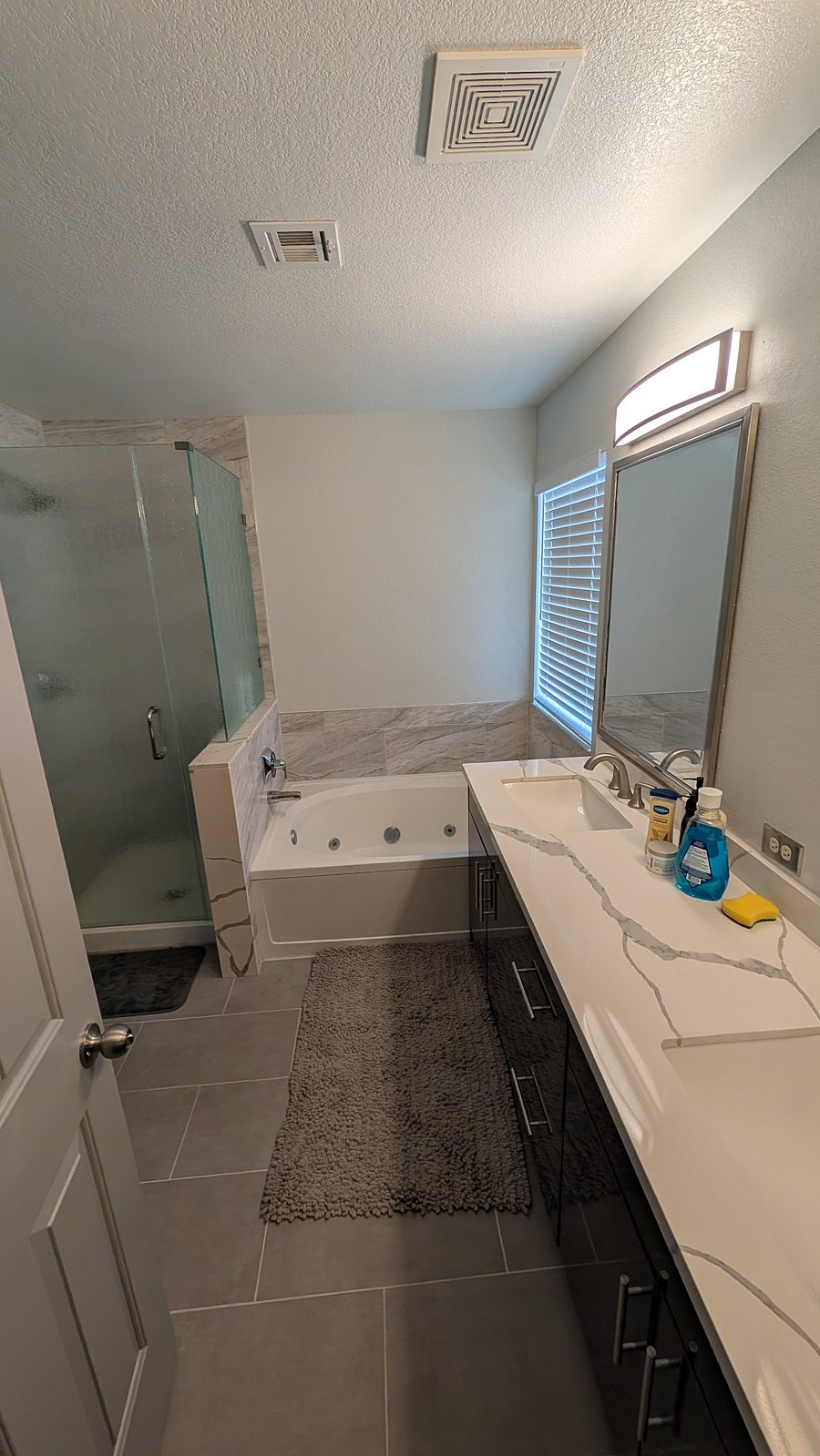 Master Bath with double sink, separate bath and shower