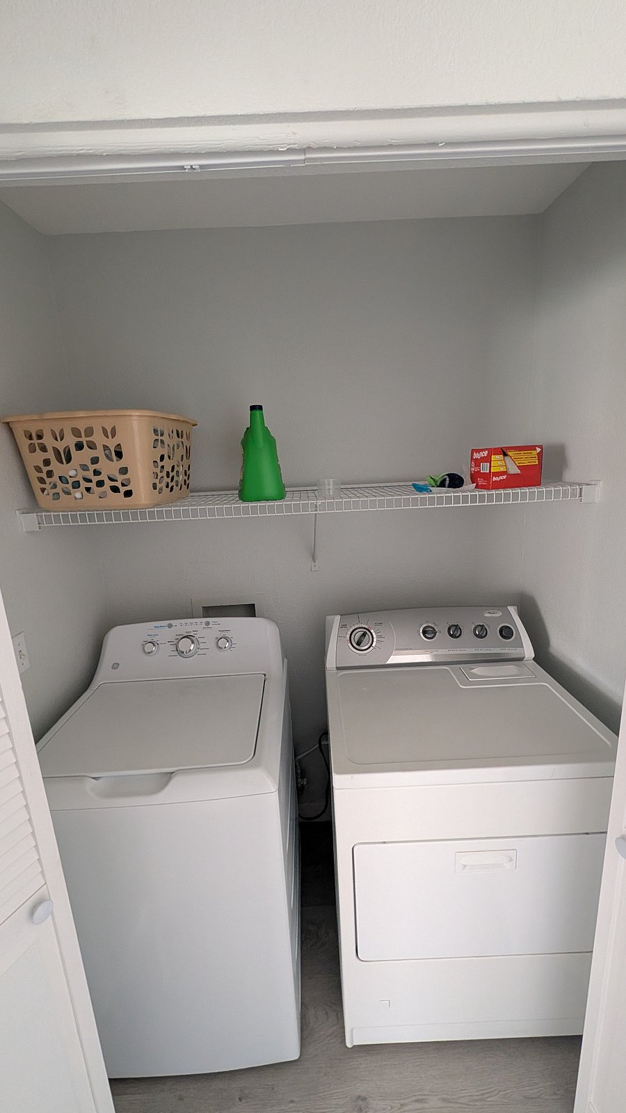 Upstairs closet with washer and drier.