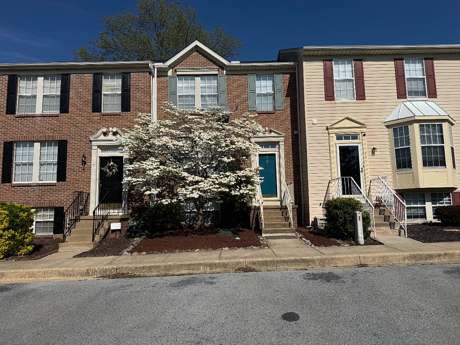 Spring exterior and two reserved parking spaces.