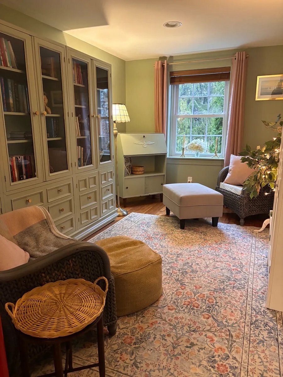 Cozy library and creative corner stocked with books to borrow, adult coloring books, colored pencils, and other analog items perfect for unwinding..