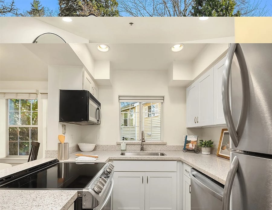 Kitchen with induction range, microwave, full size refrigerator, new dishwasher, quartz countertops, and is well stocked for your cooking and dining needs.
