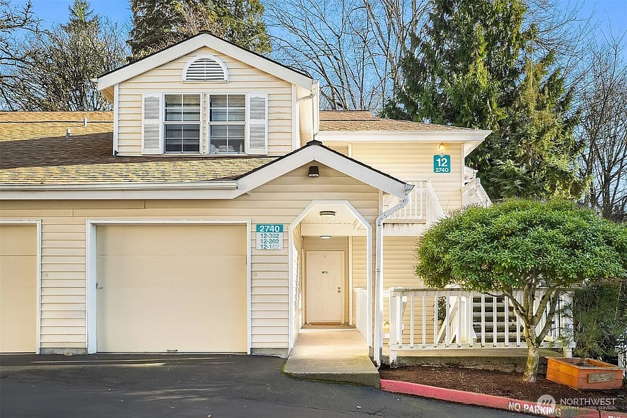 Stair-free entrance with adjacent, single-car garage.