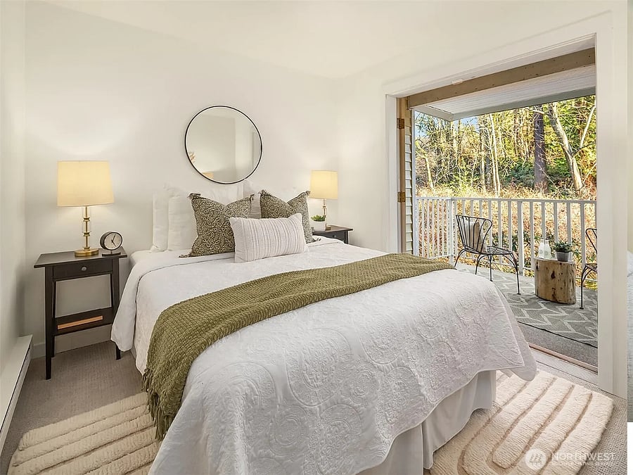 Access the balcony from the living room or french doors in the 2nd bedroom. The unit is on a sloped property, offering easy, stair-free access, and the privacy of a second story balcony.