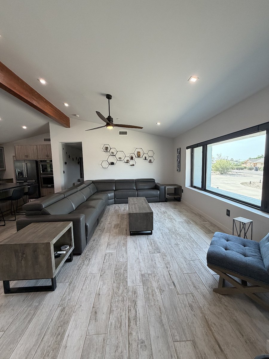 Living Room with adjustable height headrests and motorized leg lifts on three chairs.  Through this window, you can see fireworks for the holidays in the comfort of your living room couch.