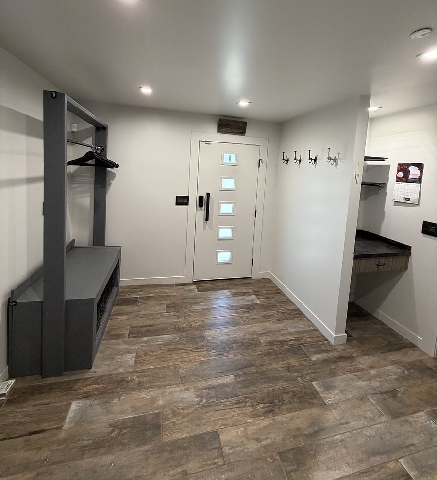 Cowboy organization stand and coat rack, and wall hooks, and exterior door to the front of the house (door #2).