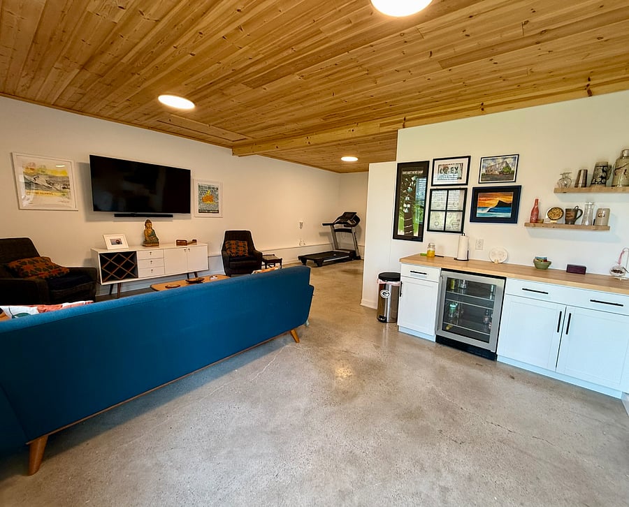 Bonus building, complete with workout area, including a NordicTrack, a Murphy bed, a stand up/sit down desk (not pictured), hang out area, and bar area.