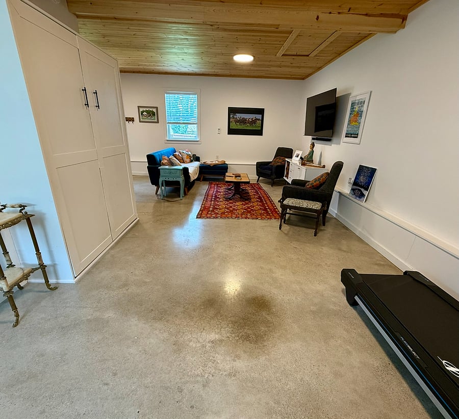 Bonus building, complete with workout area, including a NordicTrack, a Murphy bed, a stand up/sit down desk (not pictured), hang out area, and bar area.