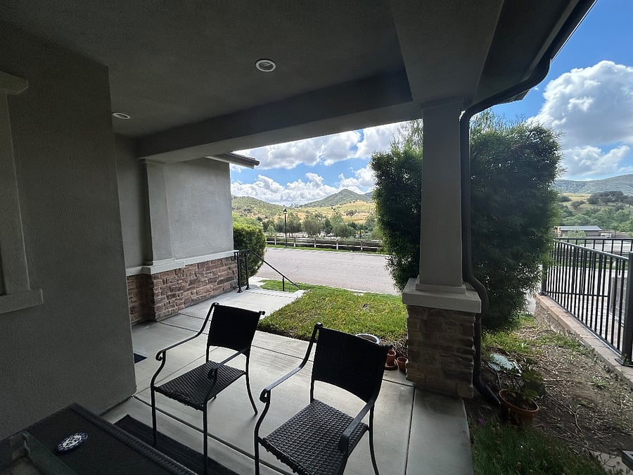 Front porch with scenic hillside views.