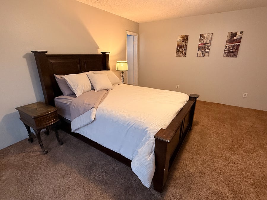Back bedroom with queen bed and attached bathroom.  Large closet.