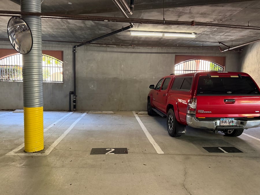 #2 assigned spot. #2 possibly as well. Both located at entrance/exit of garage.