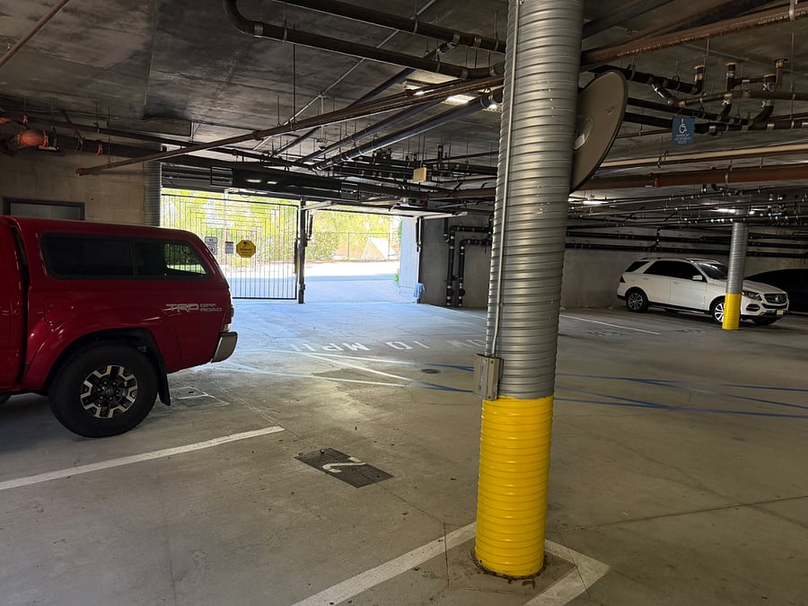 Assigned spot #2 in gated secure covered garage with elevators & stairs. #1 possibly available too. Both located at entrance/exit of garage.
