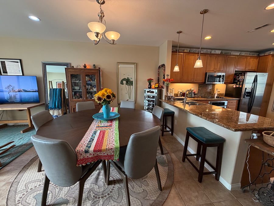 dining table and kitchen. dining table can seat up to 8.