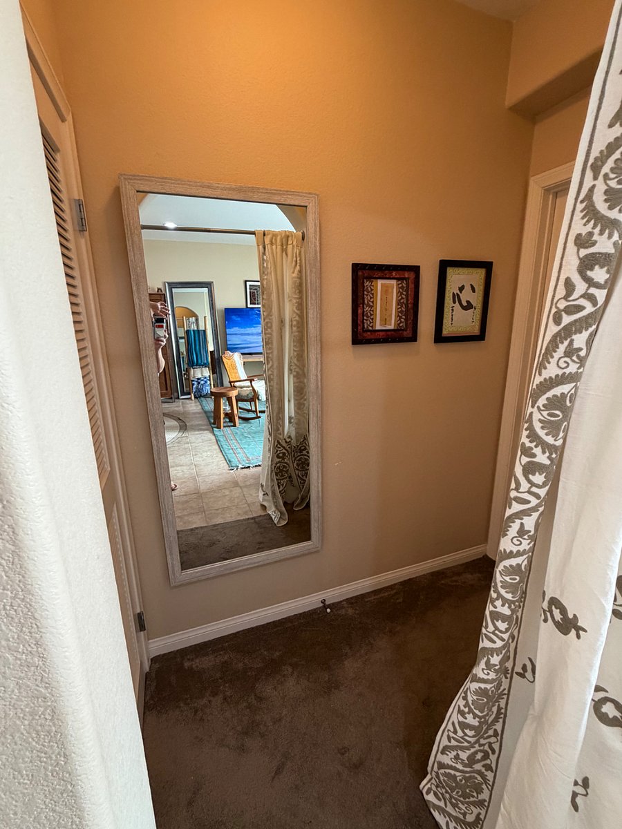 Hallway that has laundry room to the left and entrance to my master suite (which will be shut and locked) to the R. 