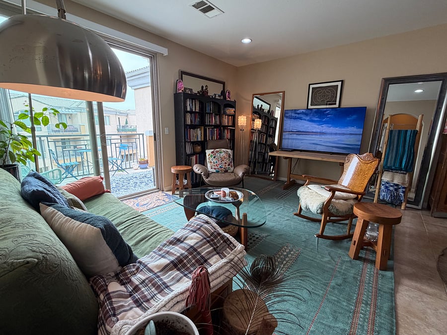 living room and balcony from entrance to laundry area.