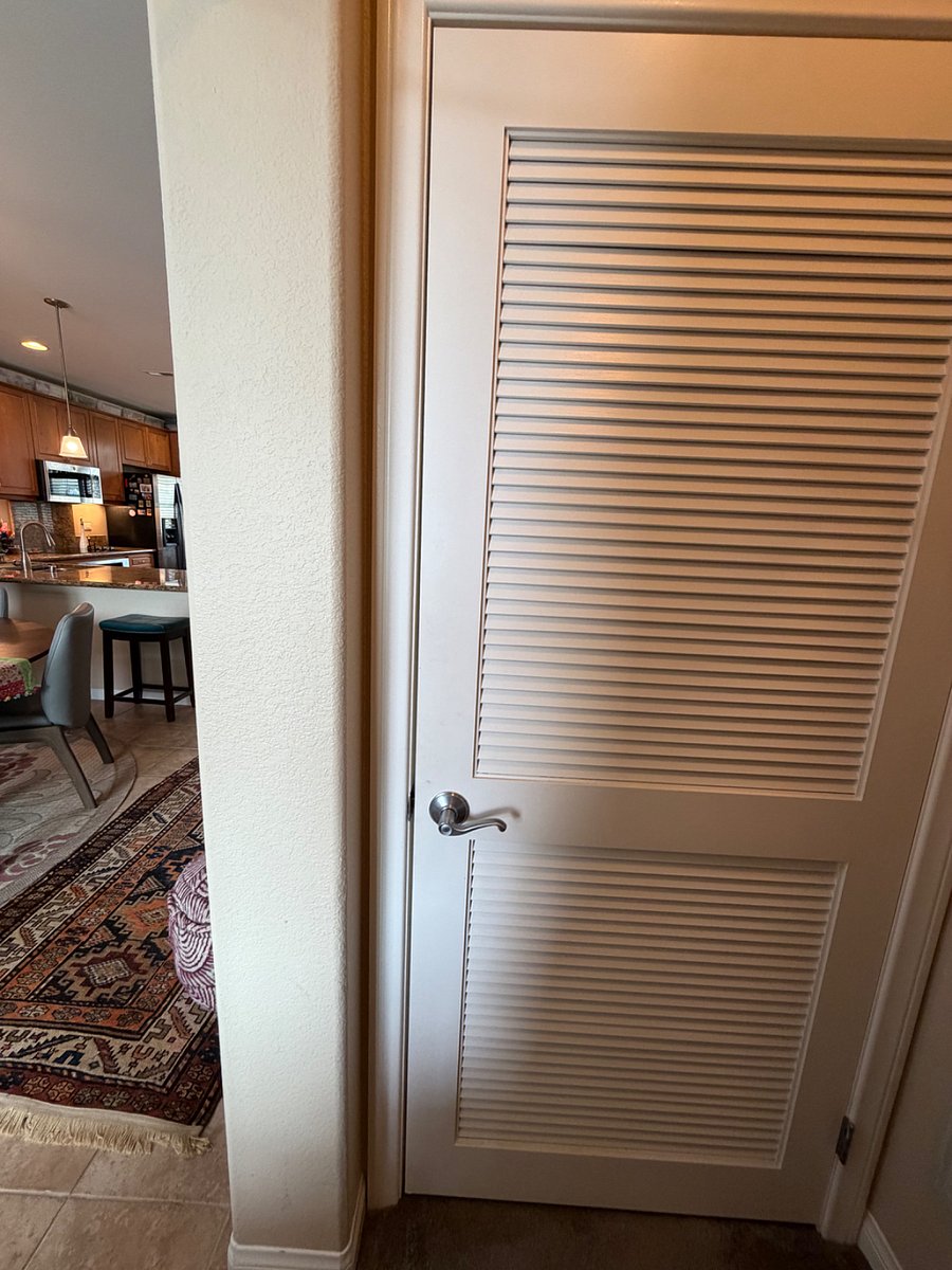 Door to condo's private laundry room in the hallway that also has the entrance to my master suite.